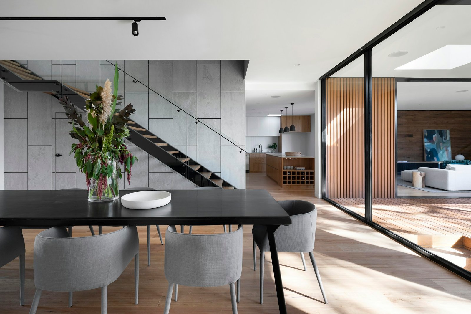 Contemporary open-plan interior with warm natural finishes